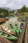 Canoes for rent. The church of St. John (Cerkev sv Janeza) at Ribcev Laz in background, Lake Bohinj (Bohinjsko jezero), Triglav National Park, Upper Carniola, Slovenia (photo)