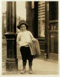 6 year old newsboy, known as Little Fattie and only 3 ft 4 ins tall, has been working for a year in St. Louis, Missouri, 1910 (b/w photo)