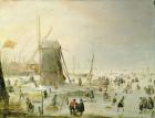 A winter scene with skaters by a windmill