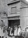Children outside John Pounds's workshop, from which he ran the first Ragged school (b/w photo)