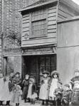 Children outside John Pounds's workshop, from which he ran the first Ragged school (b/w photo)