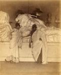 Two male students in Grecian Costume before a plaster cast of the three fates from the Elgin Marbles, c.1882-3 (albumen silver print)