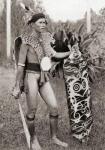 A native of Borneo in war costume. After a 19th century photograph. From Customs of The World, published c.1913.