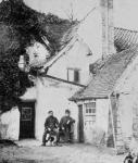 Two men outside Enfield cottage, c.1890 (b/w photo)