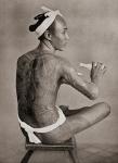 A tattooed Japanese man in the 19th century. Tattooing was a mark of low breeding and vulgarity in Japan, only coolies whose work necessitated stripping the body ever had their bodies tattooed. After a 19th century photograph. From Customs of The World, p