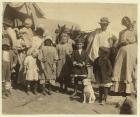 Itinerant cotton pickers leaving a farm near McKinney, Texas after picking a bale and a half of cotton a day, 1913 (b/w photo)