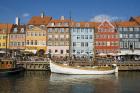 Typical architecture and boats at Nyhavn canal, Copenhagen, Denmark (photo)