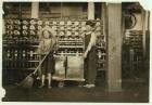 12 year old doffer Ronald Webb and 7 year old Frank Robinson, son of cardroom boss, who sweeps and doffs (clears full bobbins) at Roanoke Cotton Mills, Virginia, 1911 (b/w photo)