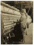 Young doffers replacing full bobbins at North Pownal, Vermont, 1910 (b/w photo)