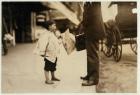 6 year old newsboy Hyman selling papers until 6 p.m. in Lawrence, Massachusetts, 1911 (b/w photo)