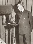 John Logie Baird, 1888 - 1946. Seen here watching the first televised play in 1930. From The Story of 25 Eventful Years in Pictures, published 1935.