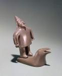 Mythological figure standing on a whale, from Cape Dorset (soapstone)