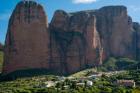 Village of Riglos beneath the conglomerate rock formations of the Mallos de Riglos, Huesca Province, Aragon, Spain. The Mallos de Riglos are approximately 300 meters high. The area is popular with climbers. (photo)