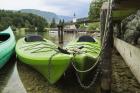 Canoes for rent. The church of St. John (Cerkev sv Janeza) at Ribcev Laz in background, Lake Bohinj (Bohinjsko jezero), Triglav National Park, Upper Carniola, Slovenia (photo)