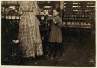 Fannie, 48 inches high, aged 7, one of 19 children helping her sister in Elk Mills, Fayetteville, Tennessee, 1910 (b/w photo)