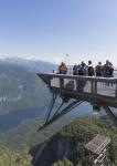 Visitors on the observation deck at the Vogel Ski Centre taking photographs, Lake Bohinj below, Triglav National Park, Upper Carniola, Slovenia (photo)