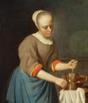 Young girl with a pestle and mortar