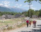 Tlos, Antalya Province, Turkey. Ruins of the ancient city. Children on road in front of theatre dating from Roman era.