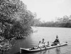 Seminole Indian and family dugout canoe, Miami, Florida, c.1910-20 (b/w photo)