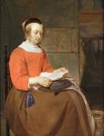 A young woman seated in an interior, reading a letter (oil on panel)