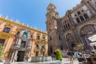 Malaga, Malaga Province, Costa del Sol, Andalusia, southern Spain. Palacio Episcopal in Plaza del Obispo. Tower of the cathedral in background.