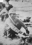 Indian soldier cooking in France, 1914-15 (b/w photo)