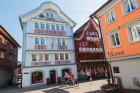 Appenzell, Appenzell Innerrhoden Canton, Switzerland. Street scene at corner of Hauptgasse and Landsgemeindeplatz.