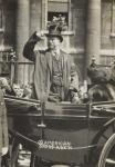Theodore Roosevelt salutes crowd (b/w photo)