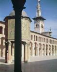 View of the Treasury (bayt al-mal) and the North minaret in the courtyard, built in 705-715 AD (photo)