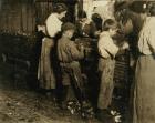 10 year old Jimmie who has been shucking 3 years (6 pots a day) with an 11 year old boy who shucks 7 pots at Varn & Platt Canning Co., Bluffton, South Carolina, 1913 (b/w photo)