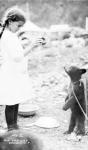 Girl and bear cub, c.1900-16