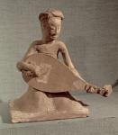 Seated musician playing a lute, from the Tomb of General Chang Sheng, Anyang, Honan, Sui Dynasty, 595 AD (stoneware)