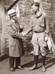 Charles Lindbergh (right) being welcomed on his arrival in Paris in 1927 by French aviator Rene Fonck. From The Story of 25 Eventful Years in Pictures, published 1935.