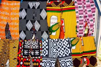 Africa, Angola, Benguela. Bright colored pants for sale at local shop. | Obraz na stenu