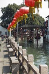 Boat in canal with old wooden bridge, Zhujiajiao, Shanghai, China | Obraz na stenu