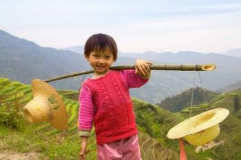 Young Girl Carrying Shoulder Pole with Straw Hats, China | Obraz na stenu