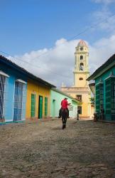 Cobblestone street with cowboy on horse, Trinidad, Cuba | Obraz na stenu