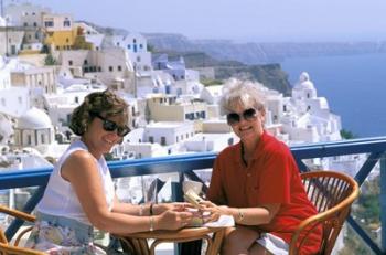 Women Having Coffee on Cafe Terrace, Santorini, Greece | Obraz na stenu