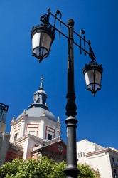 Spain, Madrid Lamppost and the dome of the Las Calatravas Church | Obraz na stenu