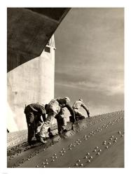 Three construction workers putting a coat of paint on a slanted wall of riveted-steel plates on the Hoover Dam spillway | Obraz na stenu