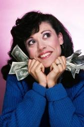 Excited Brunette Woman Holding Several Dollar Bills | Obraz na stenu