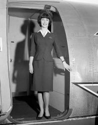 1960s Smiling Stewardess Standing In Doorway | Obraz na stenu