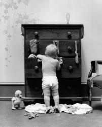 1940s Toddler Baby Pulling Clothes Out Of Bureau | Obraz na stenu
