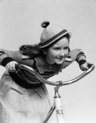 1930s Smiling Eager Little Girl In Knit Cap And Sweater Riding Bike | Obraz na stenu