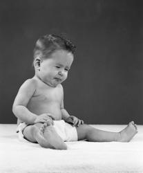 1950s Baby Sitting Up Wearing Diaper Making Face | Obraz na stenu