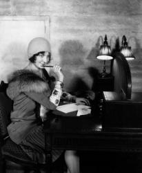 1920s  Woman With Pen To Lips Wearing Cloche Hat | Obraz na stenu