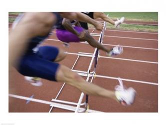 Side profile of three people jumping a hurdle | Obraz na stenu