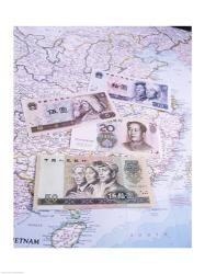 Close-up of yuan notes on a map | Obraz na stenu