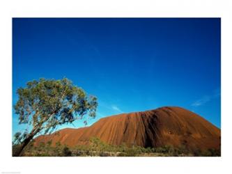 Rock formation on a landscape, Ayers Rock, Uluru-Kata Tjuta National Park, Northern Territory, Australia | Obraz na stenu