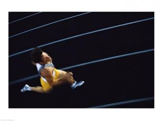 High angle view of a young man running on a running track | Obraz na stenu